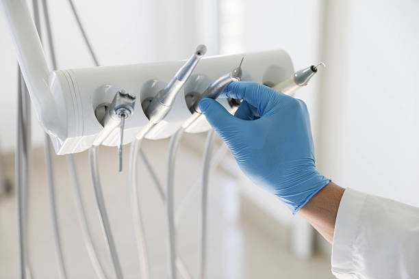 Professional Tooth Extraction technician working in Arlington, GA